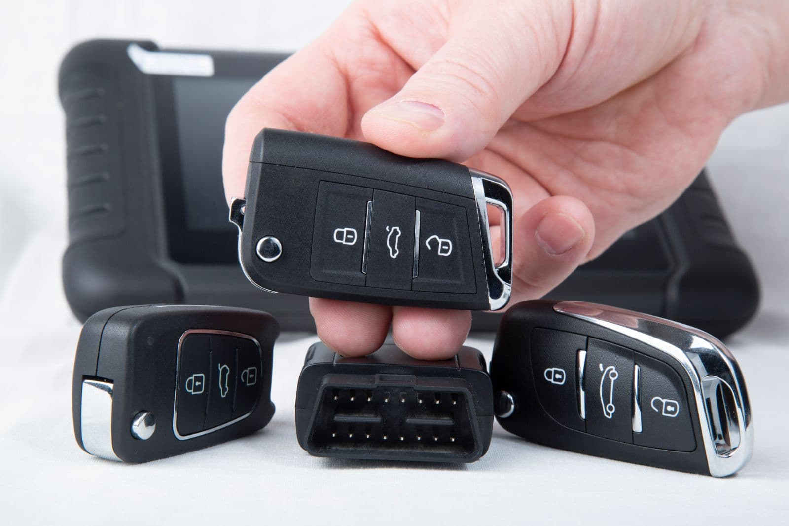 Professional locksmith service cutting new car key on site